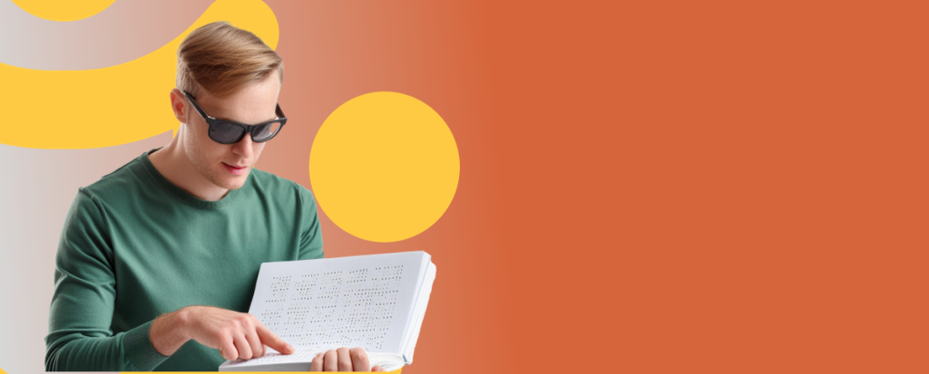 A man reads braille against a vibrant orange and yellow background.